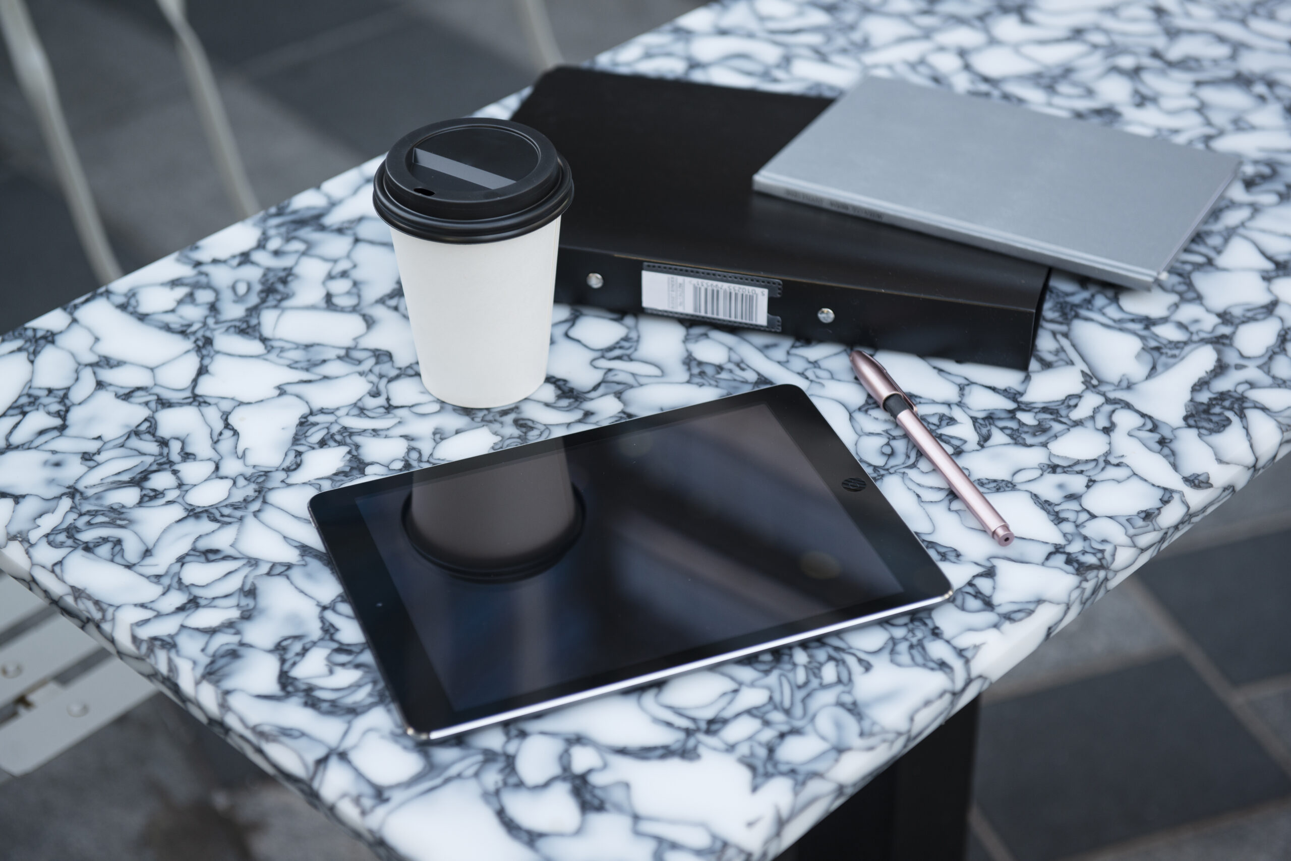 Tablet and coffee on marble desk. - Run It By Britt