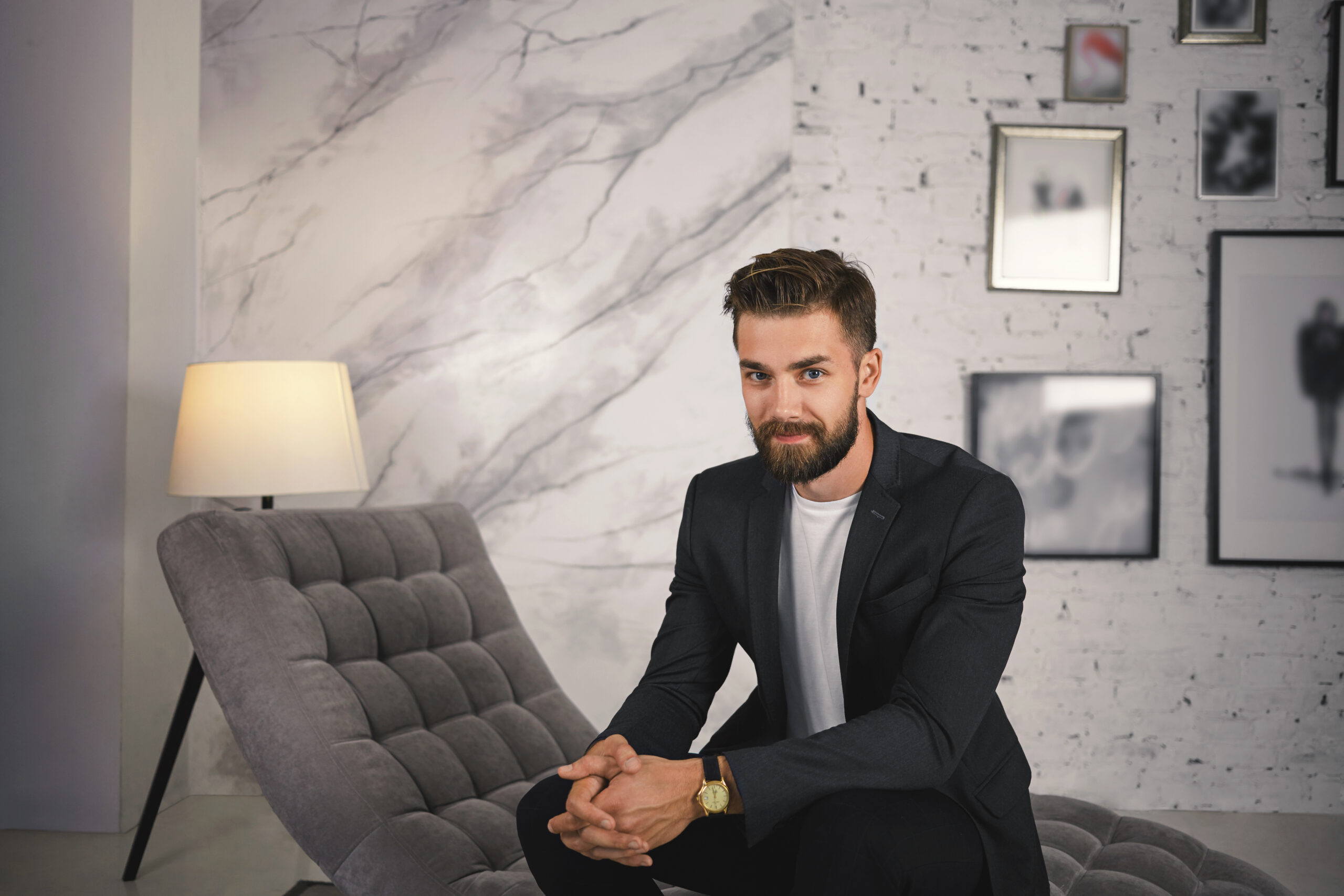 Man in blazer on tufted chair. - Run It By Britt